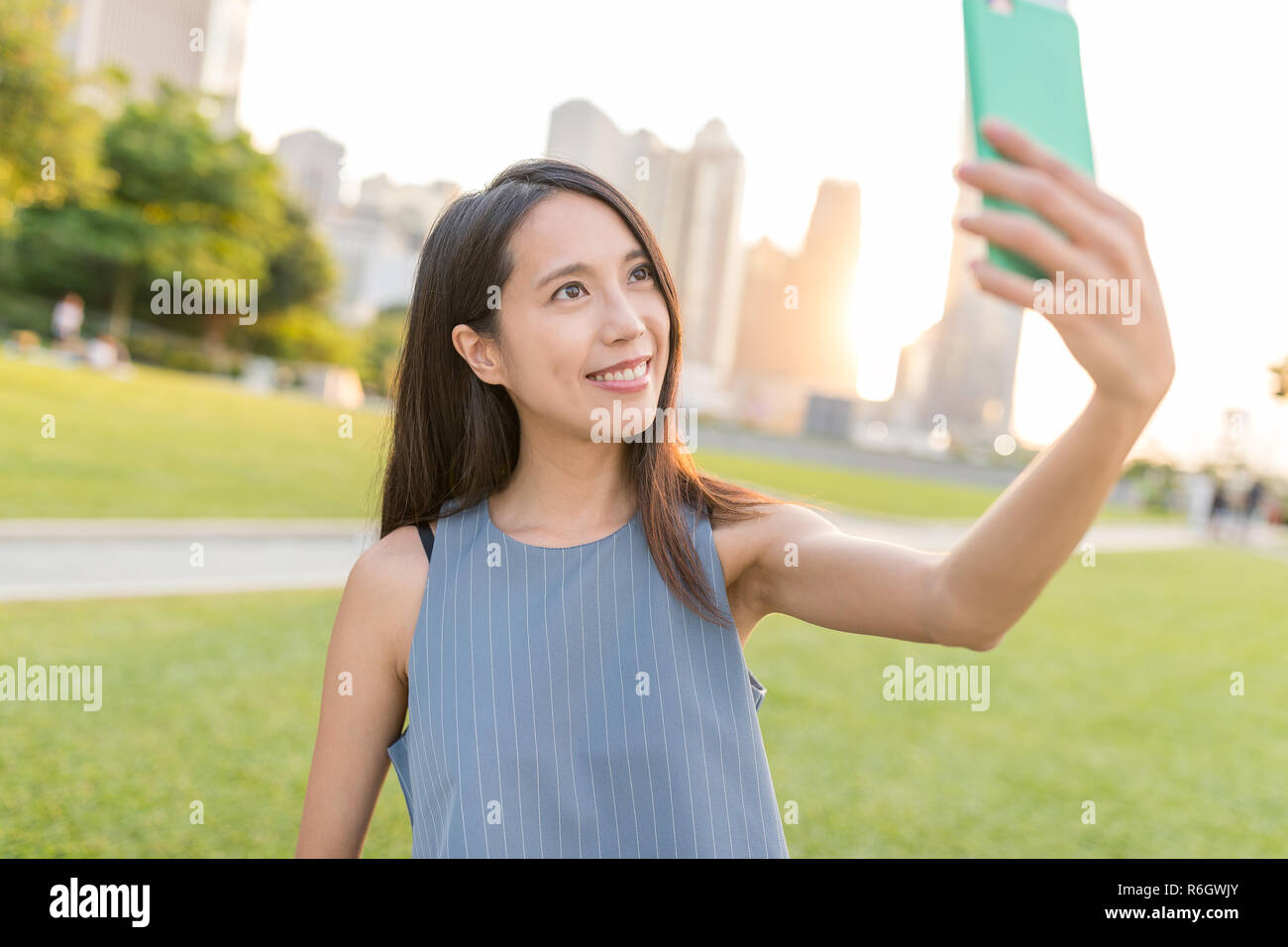 Woman taking selfie in Hong Kong Stock Photo - Alamy