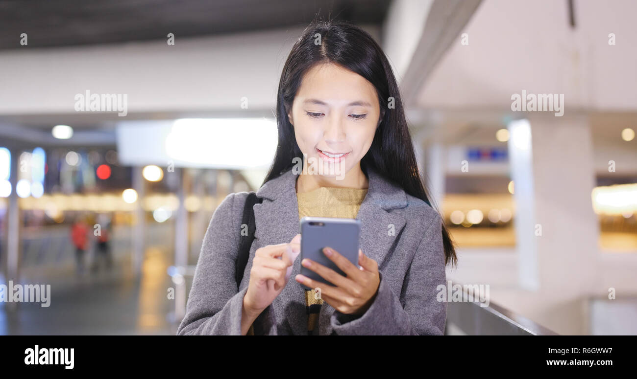Asian business woman use of smart phone in Hong Kong at night Stock ...