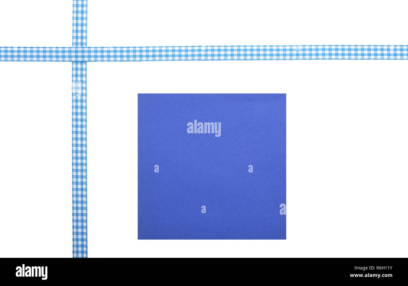 Checked ribbon and paper on white background Stock Photo