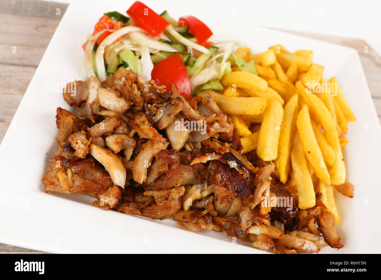 chicken döner with fries and salad Stock Photo - Alamy