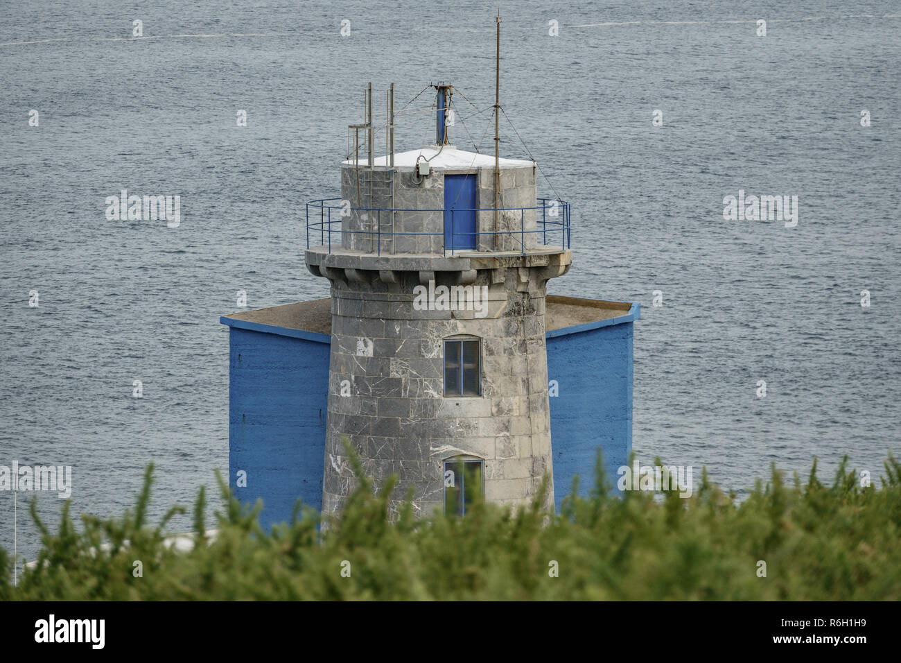 Machichaco cape old lighthouse high section view against ocean Stock Photo