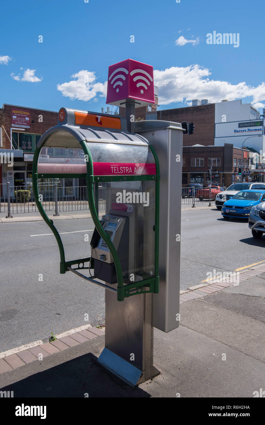 A fixed line Telstra payphone in Gordon with wifi. It has been claimed that Telstra are getting free advertising space using the back of these phones Stock Photo