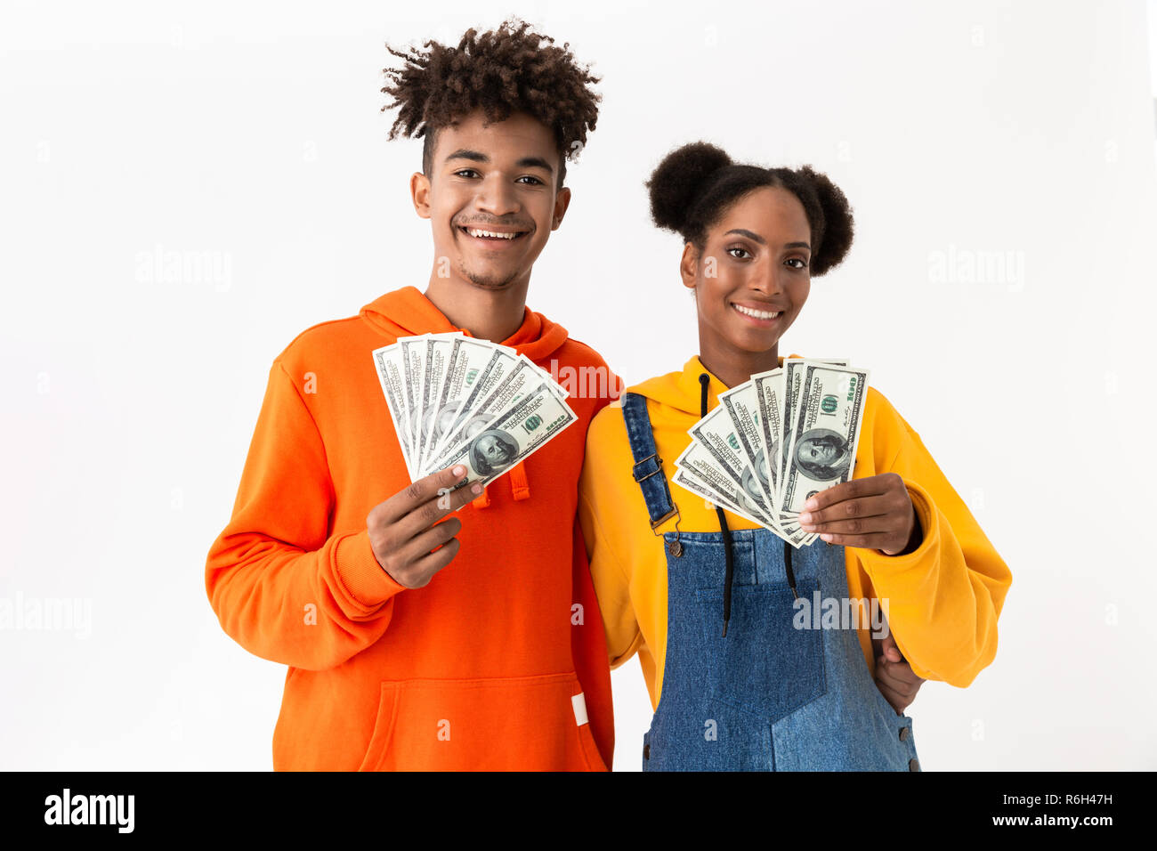 Portrait of a two cheerful young african couple isolated over white ...