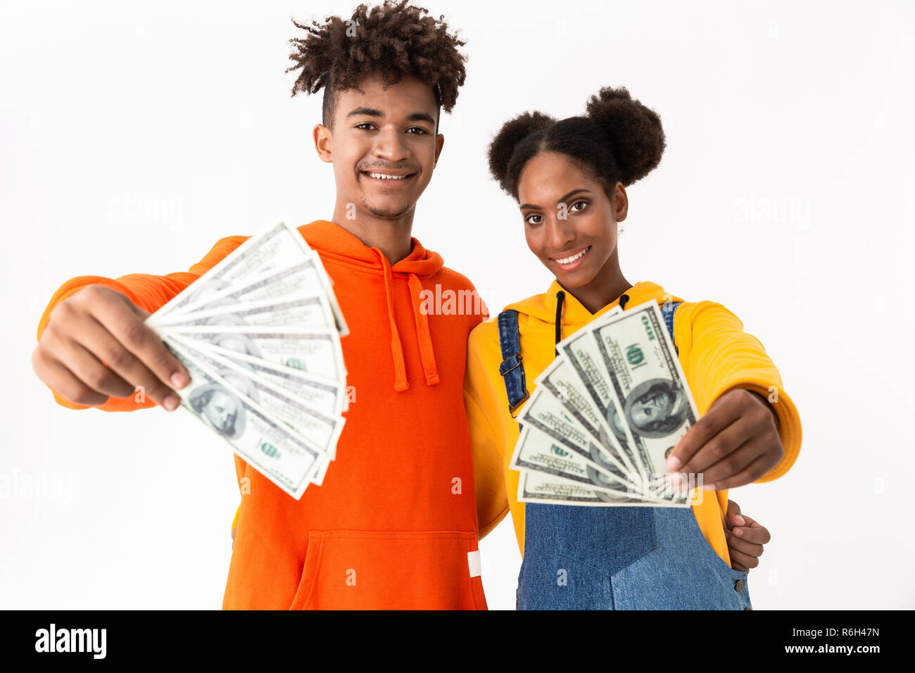 Portrait of a two excited young african couple isolated over white ...