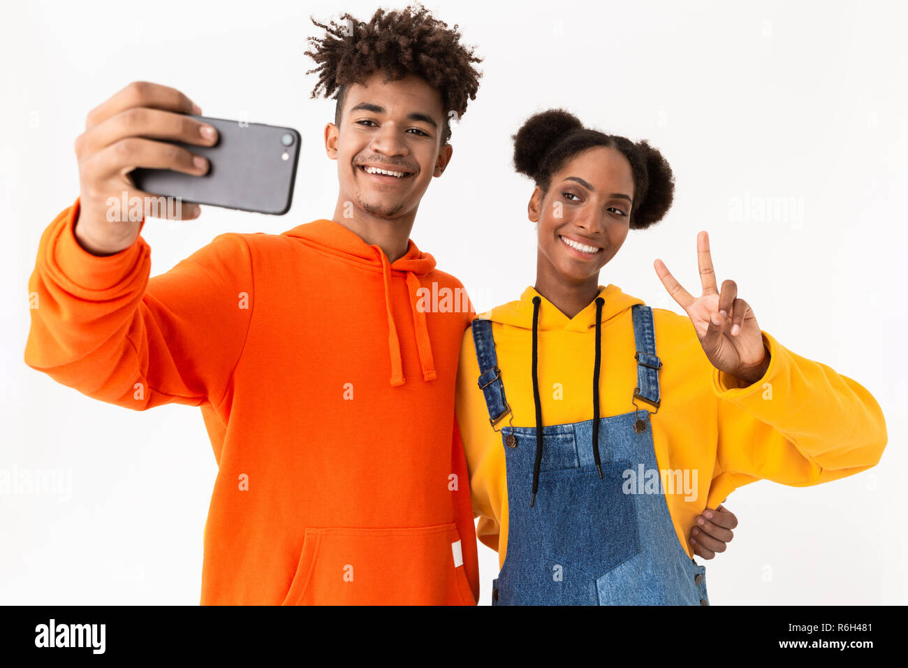 Portrait of a two happy young african couple isolated over white ...