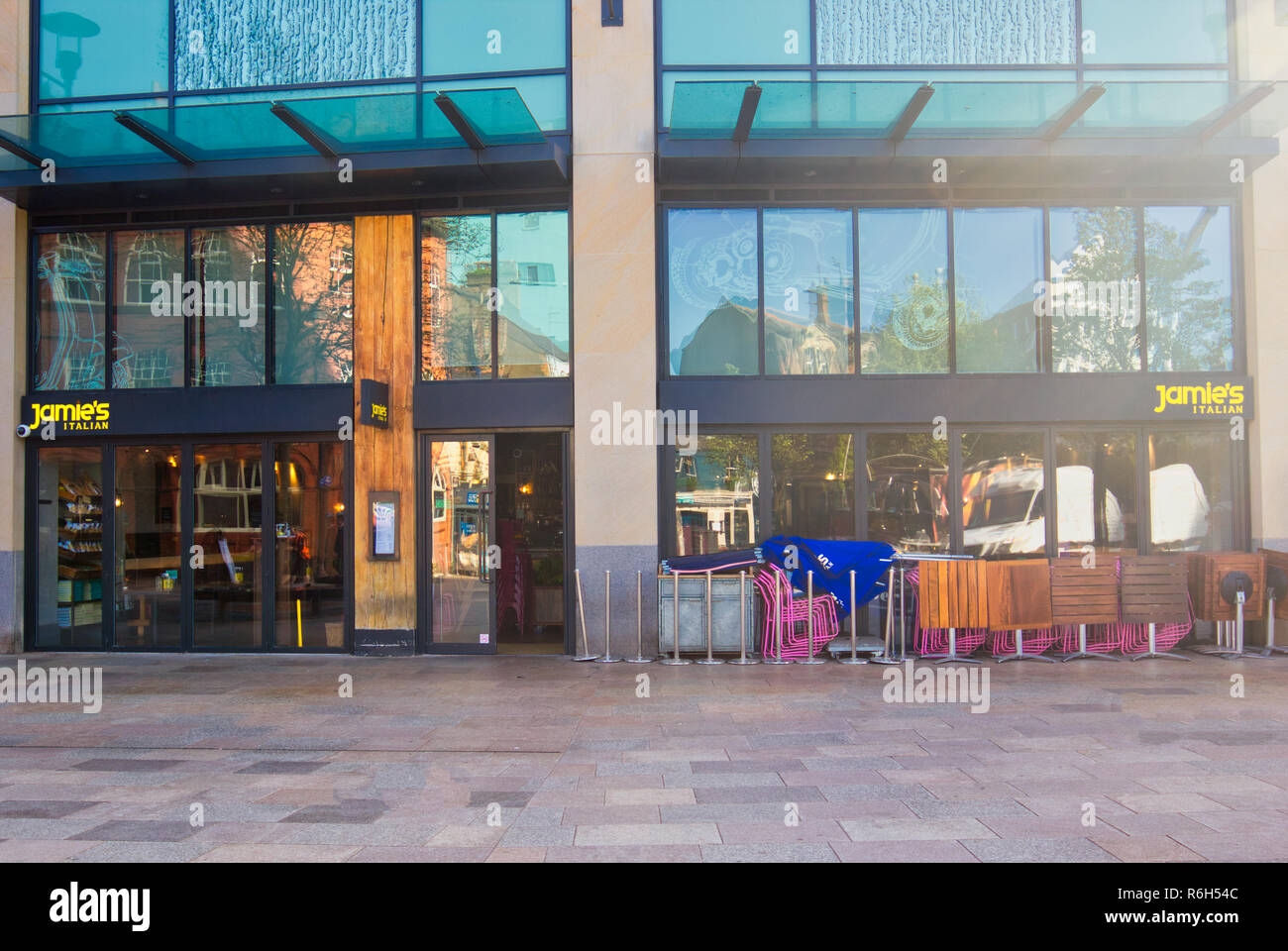 Tables outside Jamie's Italian restaurant as it prepares to open, Cardiff, Wales, United Kingdom Stock Photo