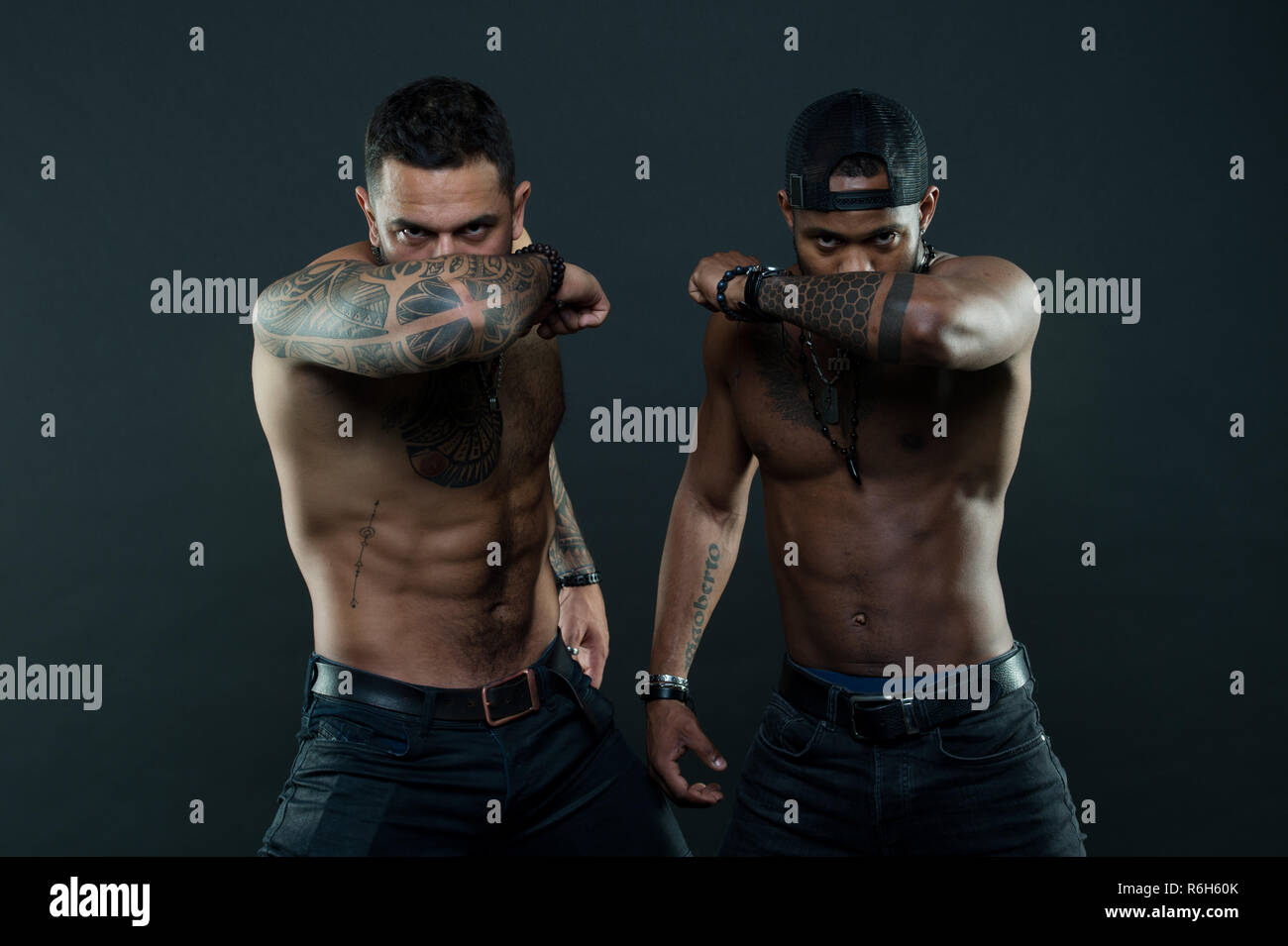 Do tattoos hide lack of masculinity. Men brutal guys cover faces with