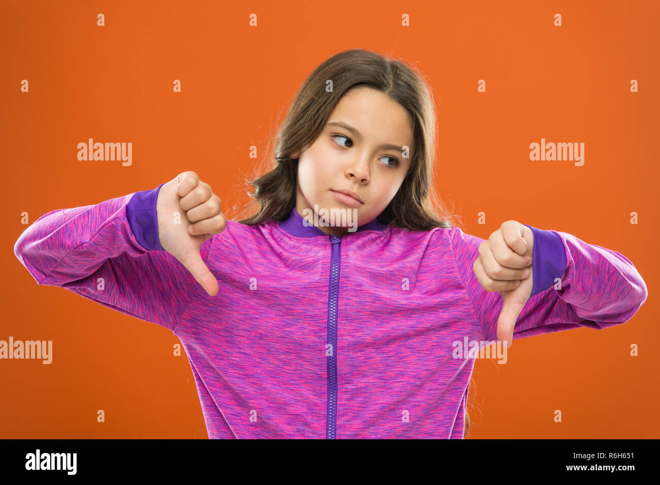 Girl little kid sad face dislike something. Kid unhappy small baby