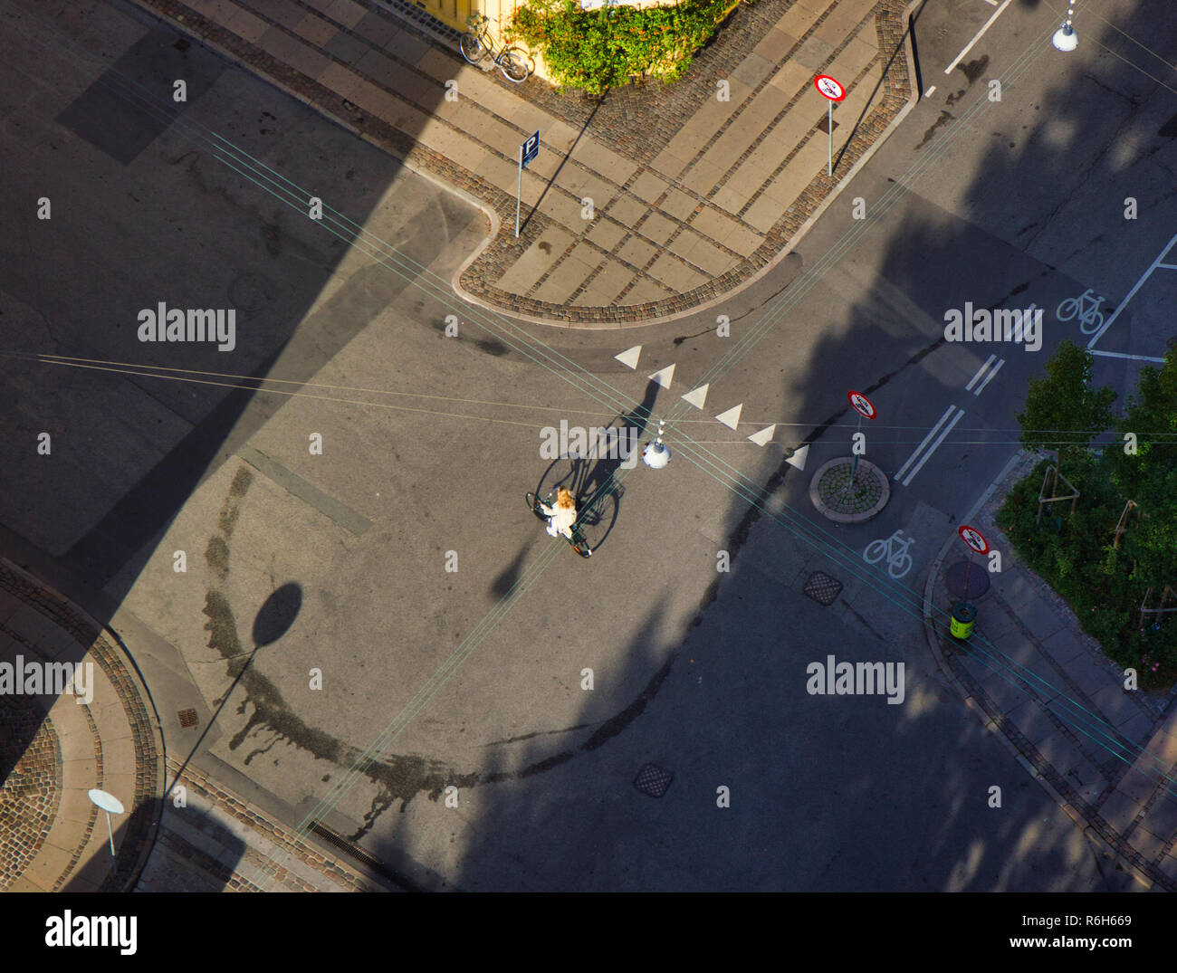 High angle shot of cyclist and shadow, Christianshavn, Copenhagen, Denmark, Scandinavia Stock Photo