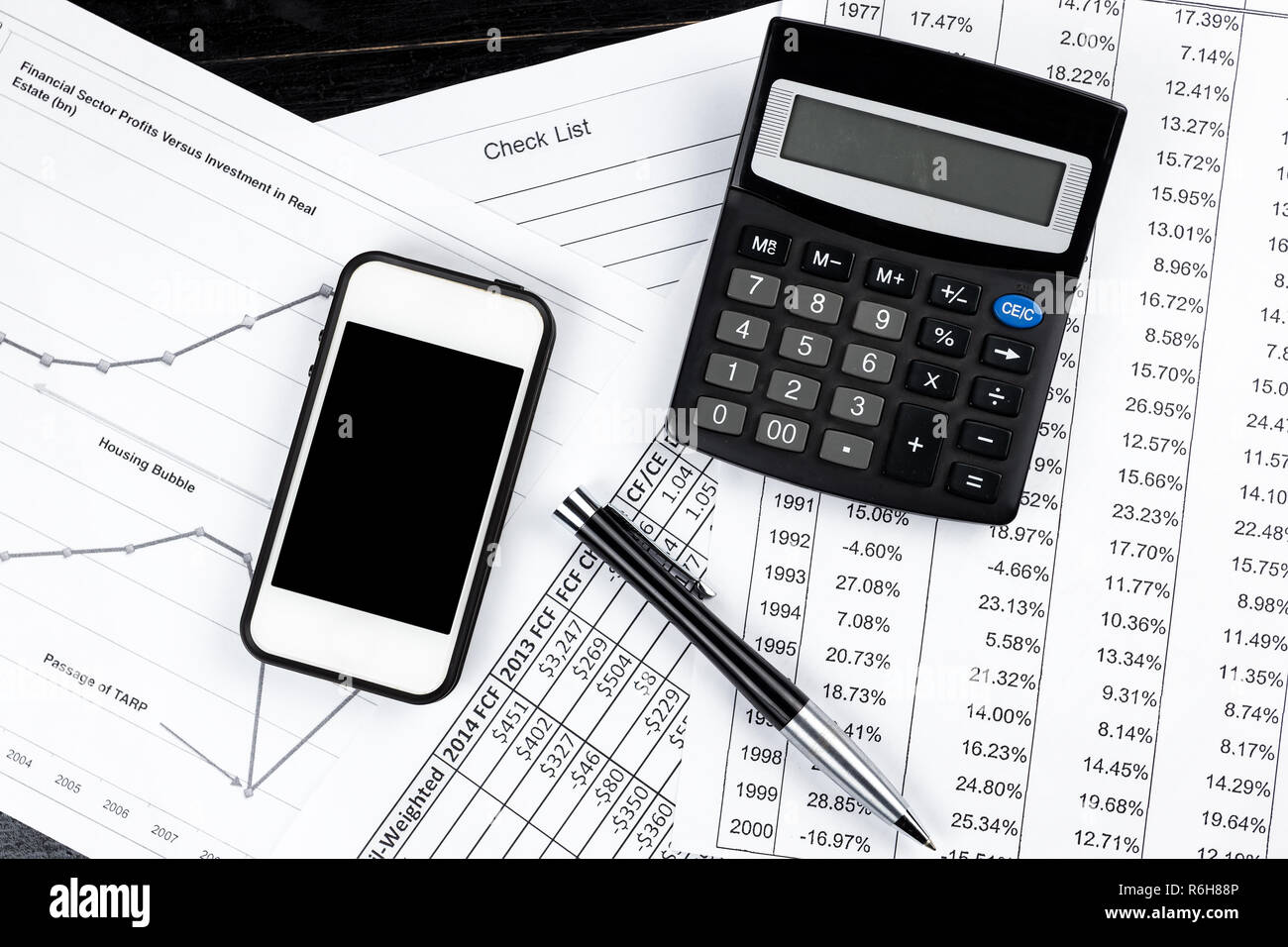Business black and white items smartphone, elegant pen, calculator