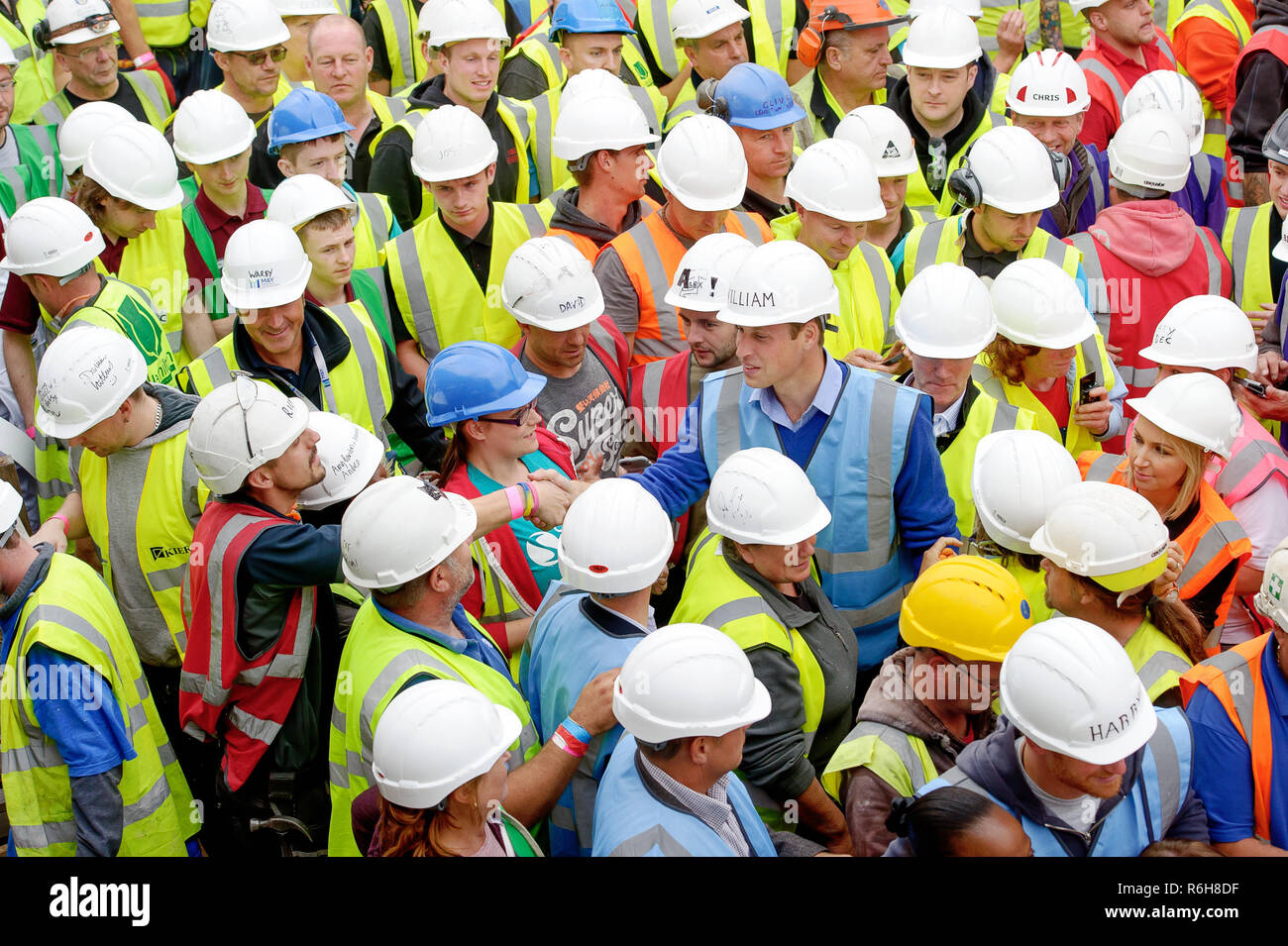 Prince William, Duke of Cambridge pictured meeting tradesmen on the BBC's DIY SOS project in Manchester. Stock Photo