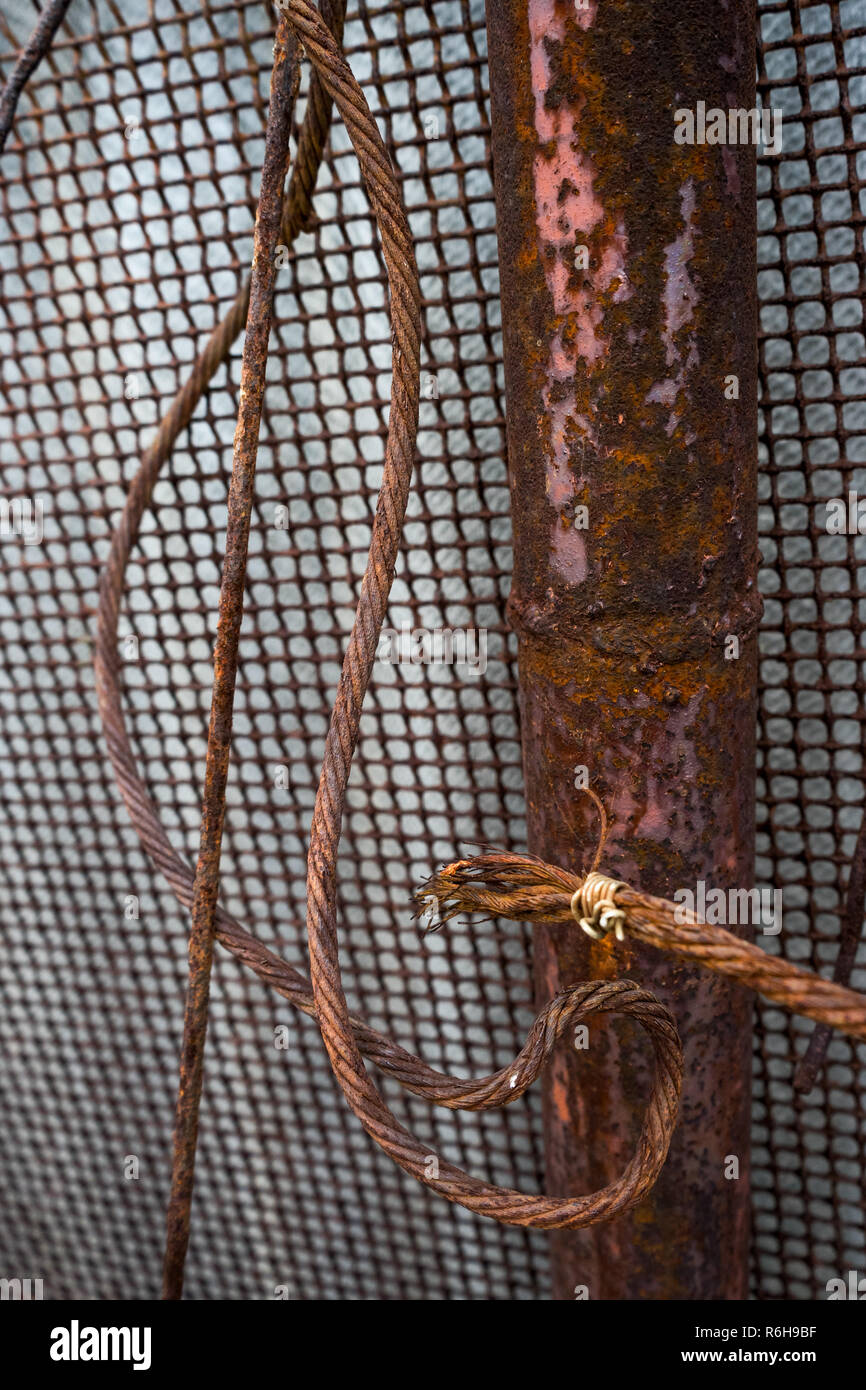 old rusty fence with pipe, mesh and wire Stock Photo Alamy