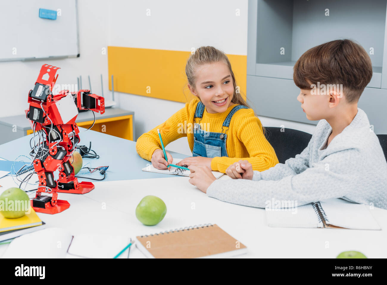 cheerful schoolchildren talking at STEM robotics lesson Stock Photo - Alamy