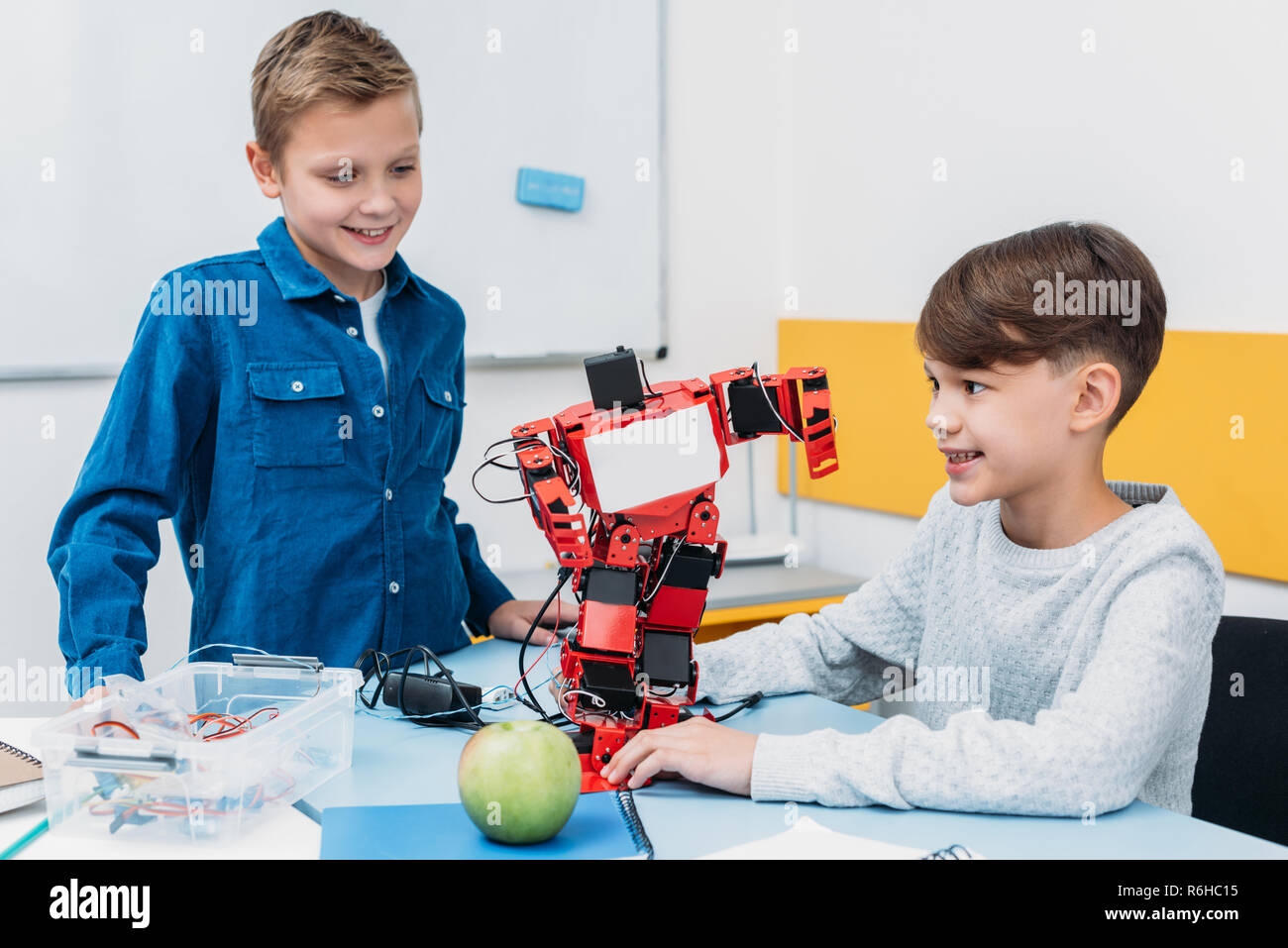 schoolboys working on robot at STEM robotics lesson Stock Photo