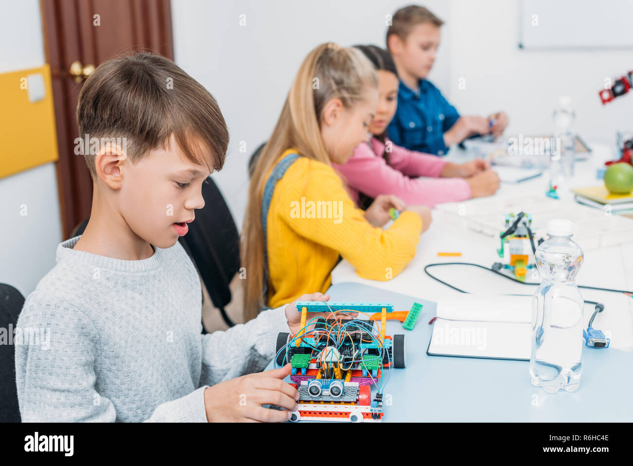 focused children working together on STEM project in classrom Stock Photo