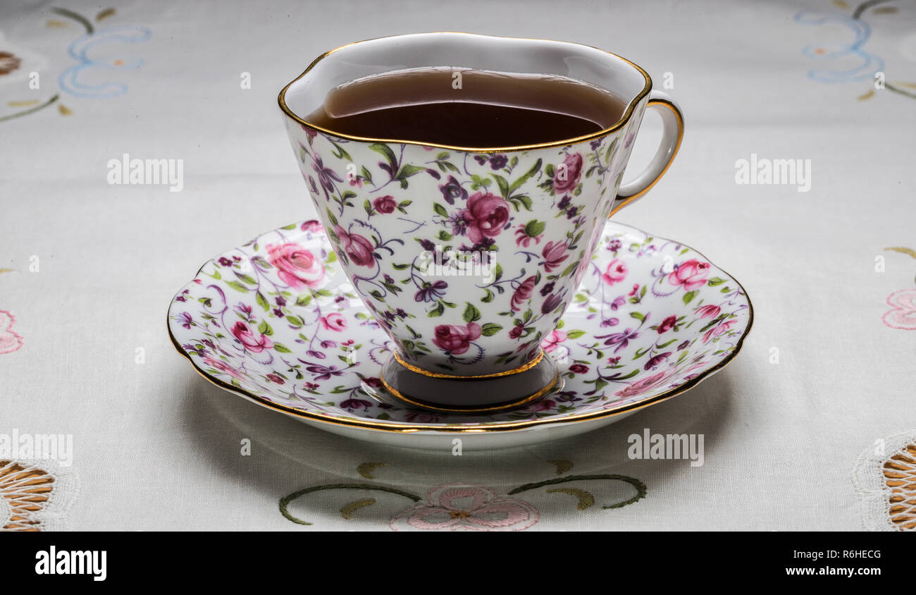 royal vale bone china tea cup with tea, and saucer Stock Photo - Alamy