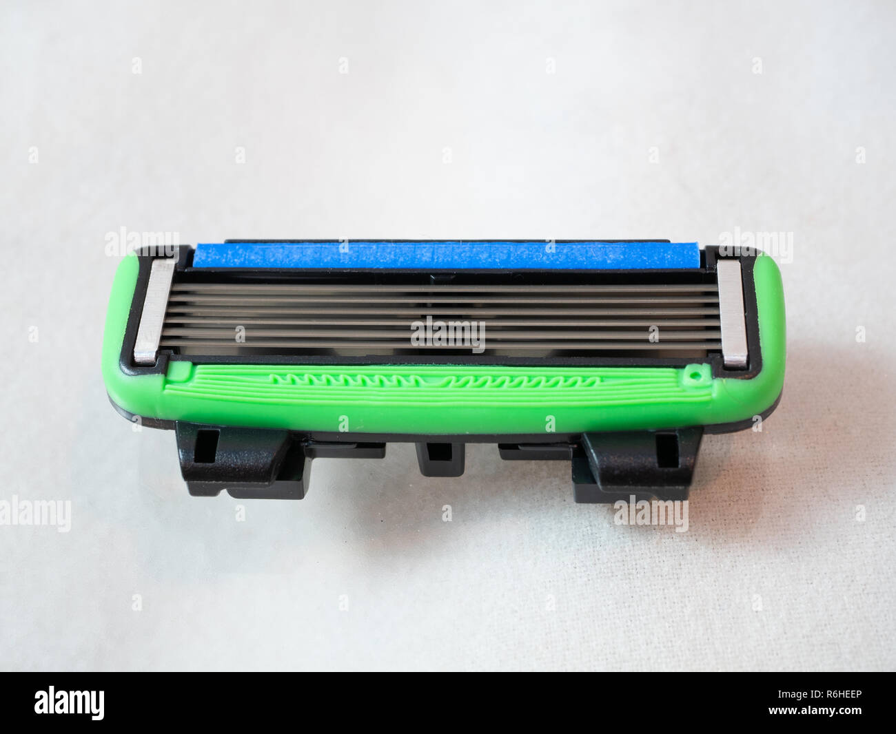 macro close-up of safe replaceable shaving razor blade refill cartridge