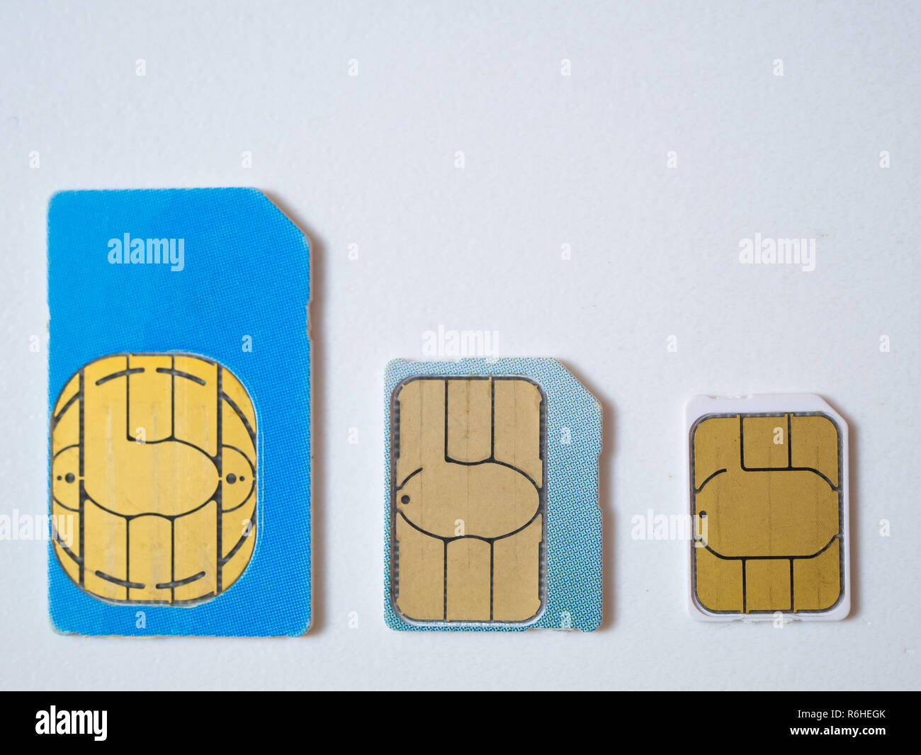 three sim cards micro, nano 4g lte 5g ready on white background. flat lay shot from the top Stock Photo