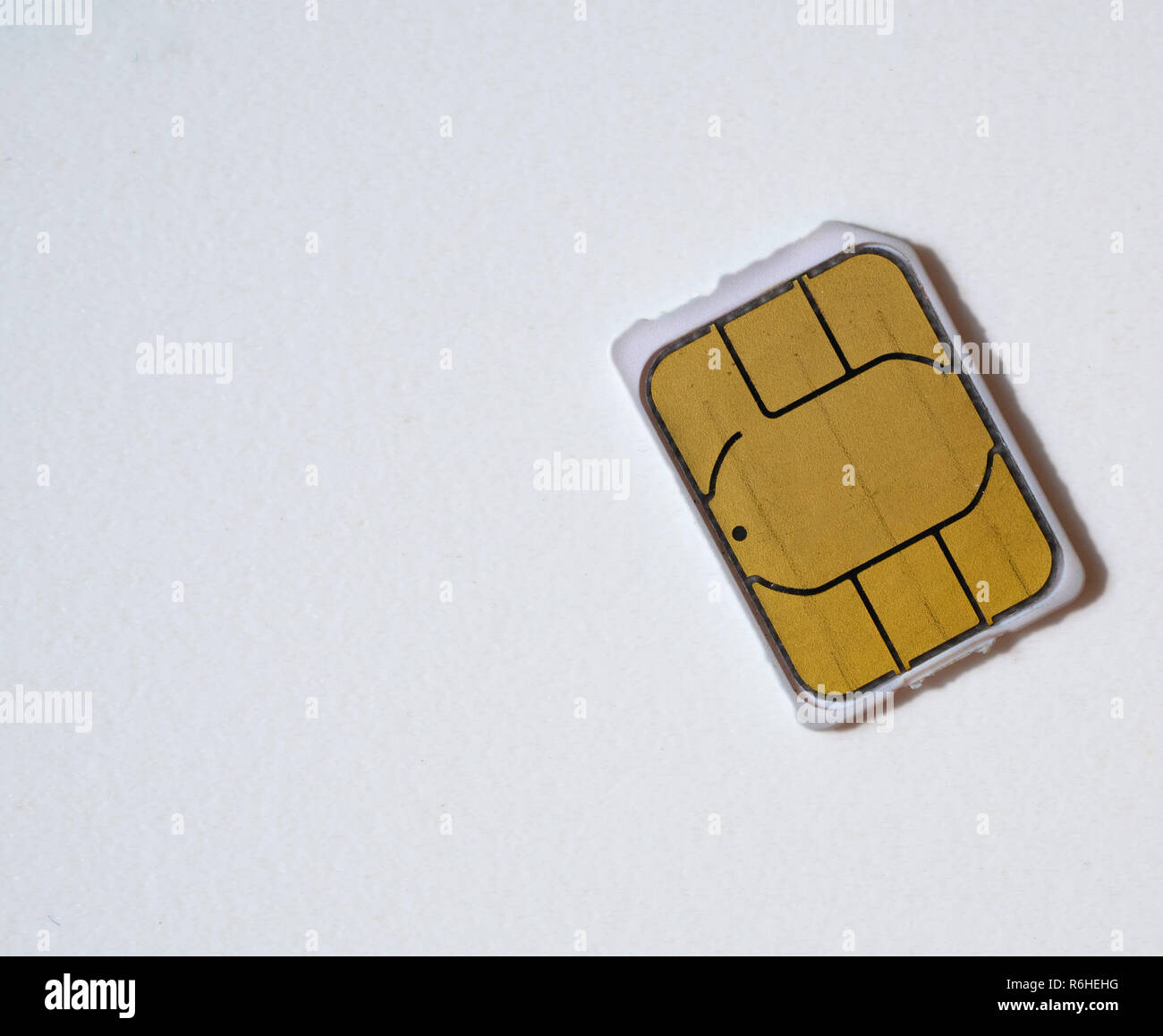 macro close-up shot of nano sim card 5g ready on white background. flat lay from the top Stock Photo
