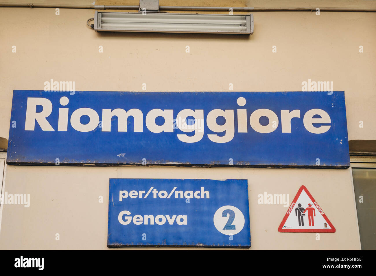 Riomaggiore, Italy - October 30, 2016: View of train station name in Riomaggiore, one of Cinque Terre villages, on a bright day. Cinque Terre was incl Stock Photo