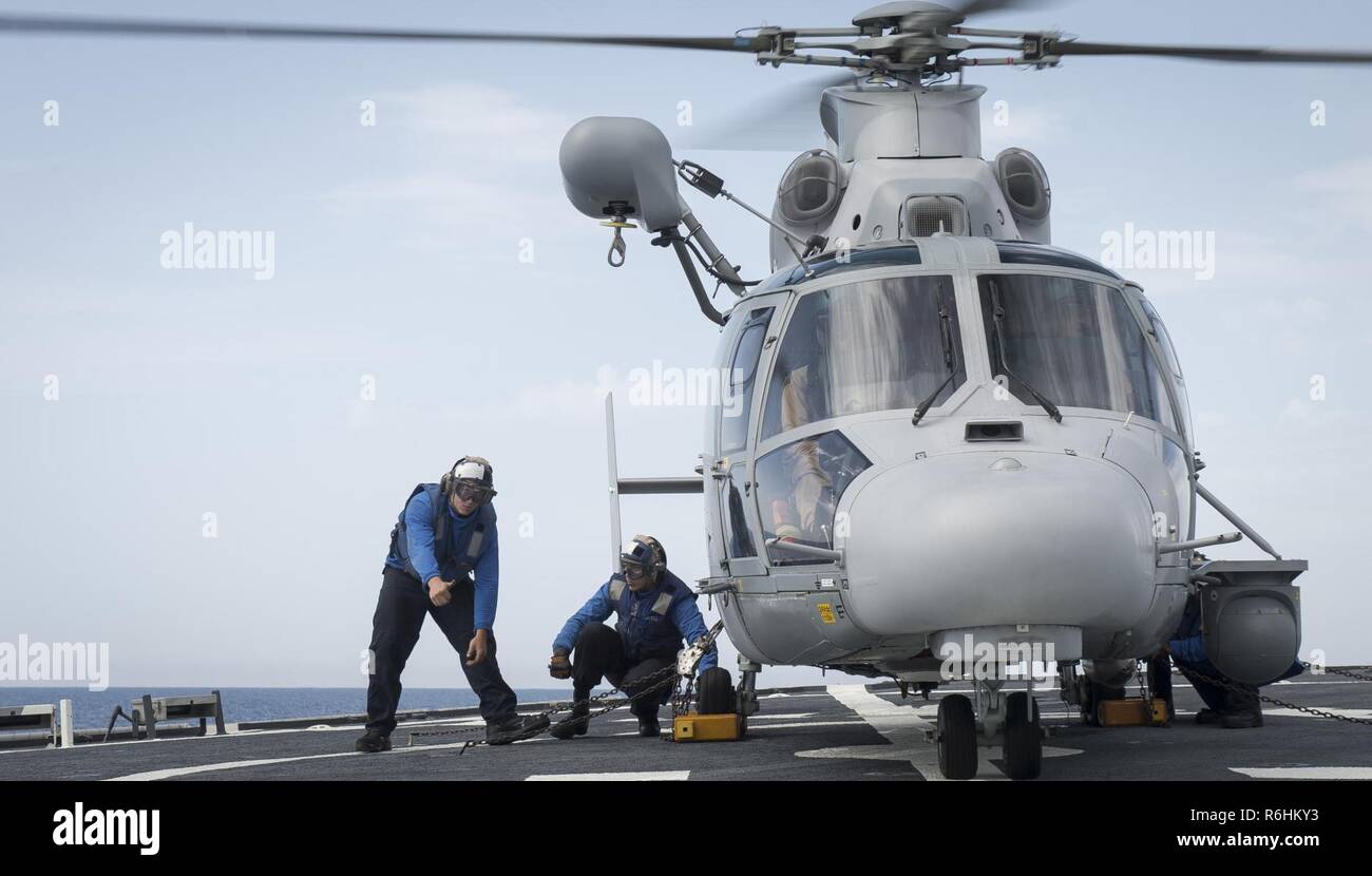 MEDITERRANEAN SEA (May 18, 2017) Boatswain's Mate 3rd Class Bradley Warring, from Lompoc, California, left, and Boatswain's Mate Seaman Jacob Ellingson, from Johnstown, Colorado, chock and chain a French Navy Panther anti-submarine helicopter, assigned to the Cassard-class anti-air frigate FS Jean Bart (D615), during flight quarters aboard the Arleigh Burke-class guided-missile destroyer USS Ross (DDG 71) May 18, 2017. Ross, forward-deployed to Rota, Spain, is conducting naval operations in the U.S. 6th Fleet area of operations in support of U.S. national security interests in Europe and Afric Stock Photo
