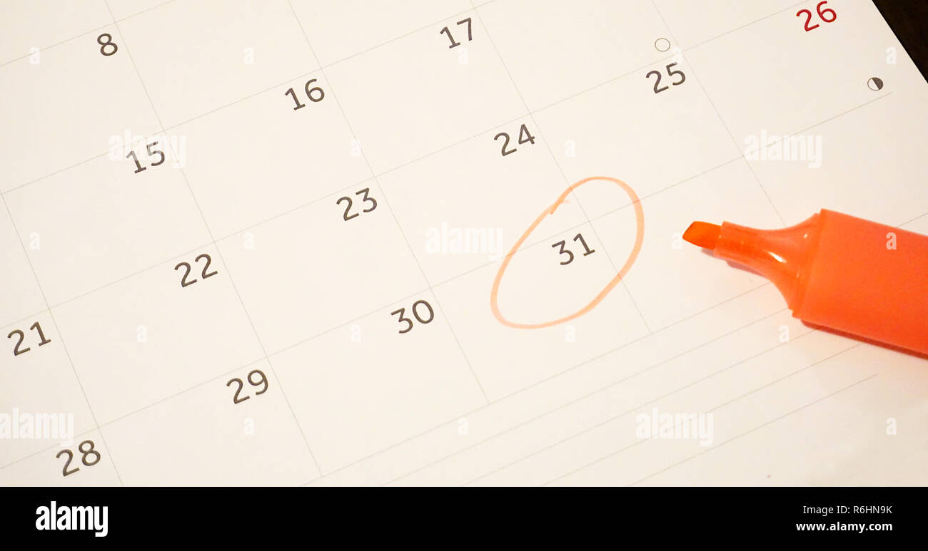 Calendar sheet with 31st day circled with orange pen. End of the month or year concept Stock Photo