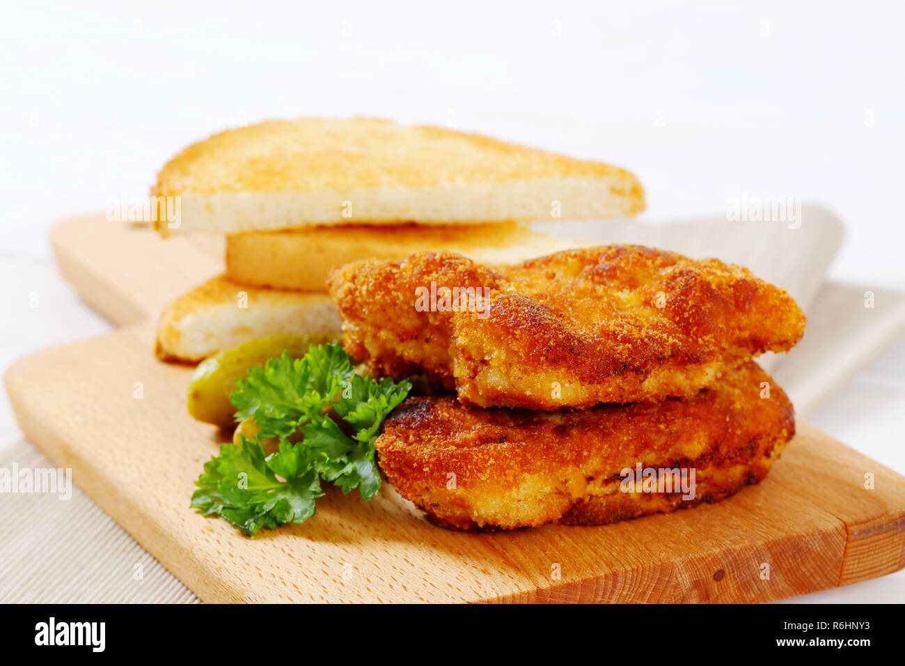 breaded schnitzels with toast Stock Photo Alamy
