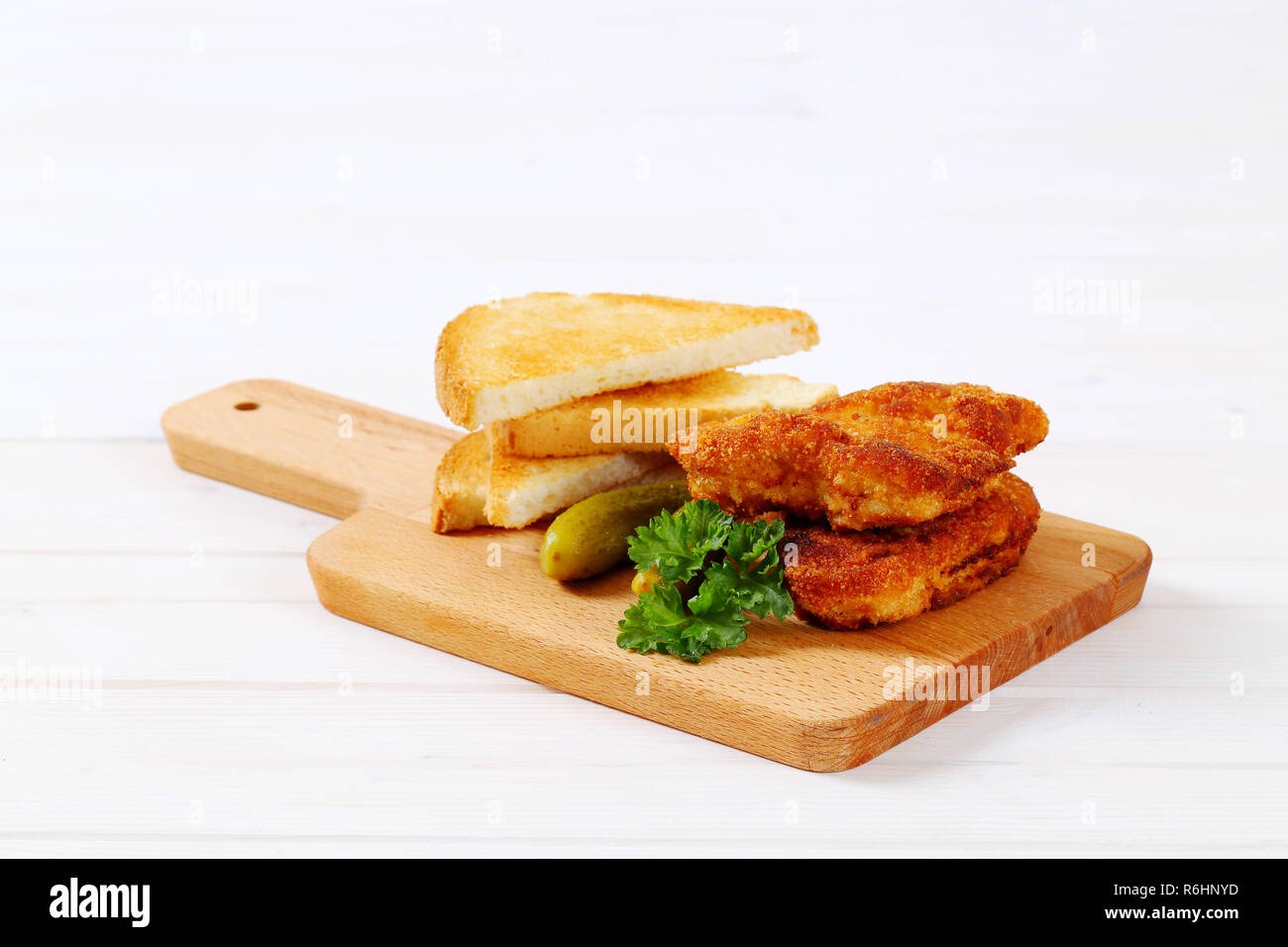 breaded schnitzels with toast Stock Photo Alamy