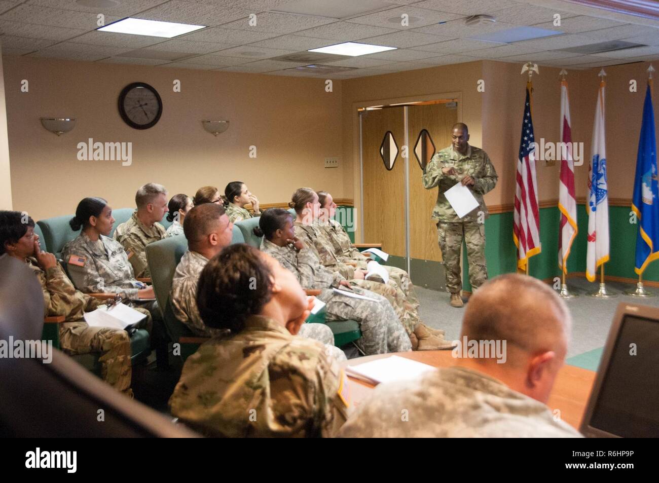 Master Sgt. Porter (standing), Army National Guard IPPS-A liaison officer, and noncommissioned officer in charge, briefs members of the District of Columbia National Guard personnel staff about the IPPS-A program May 16, 2017, Washington, D.C. Stock Photo