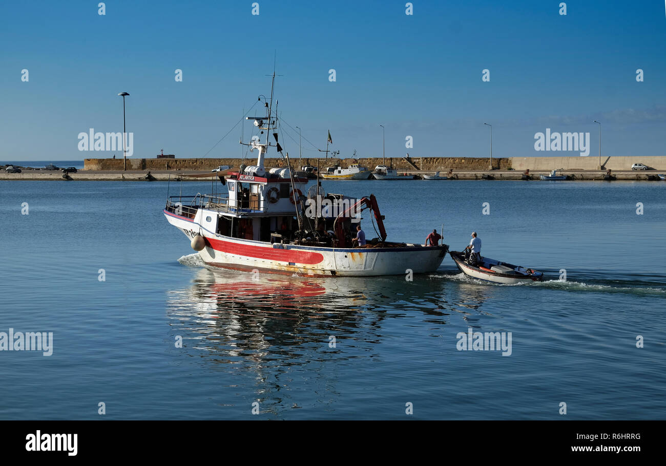 Harbour of Marsala, Sicily, Italy 19 september 2017 - Fisching boat exiting from the Port at the morning Stock Photo