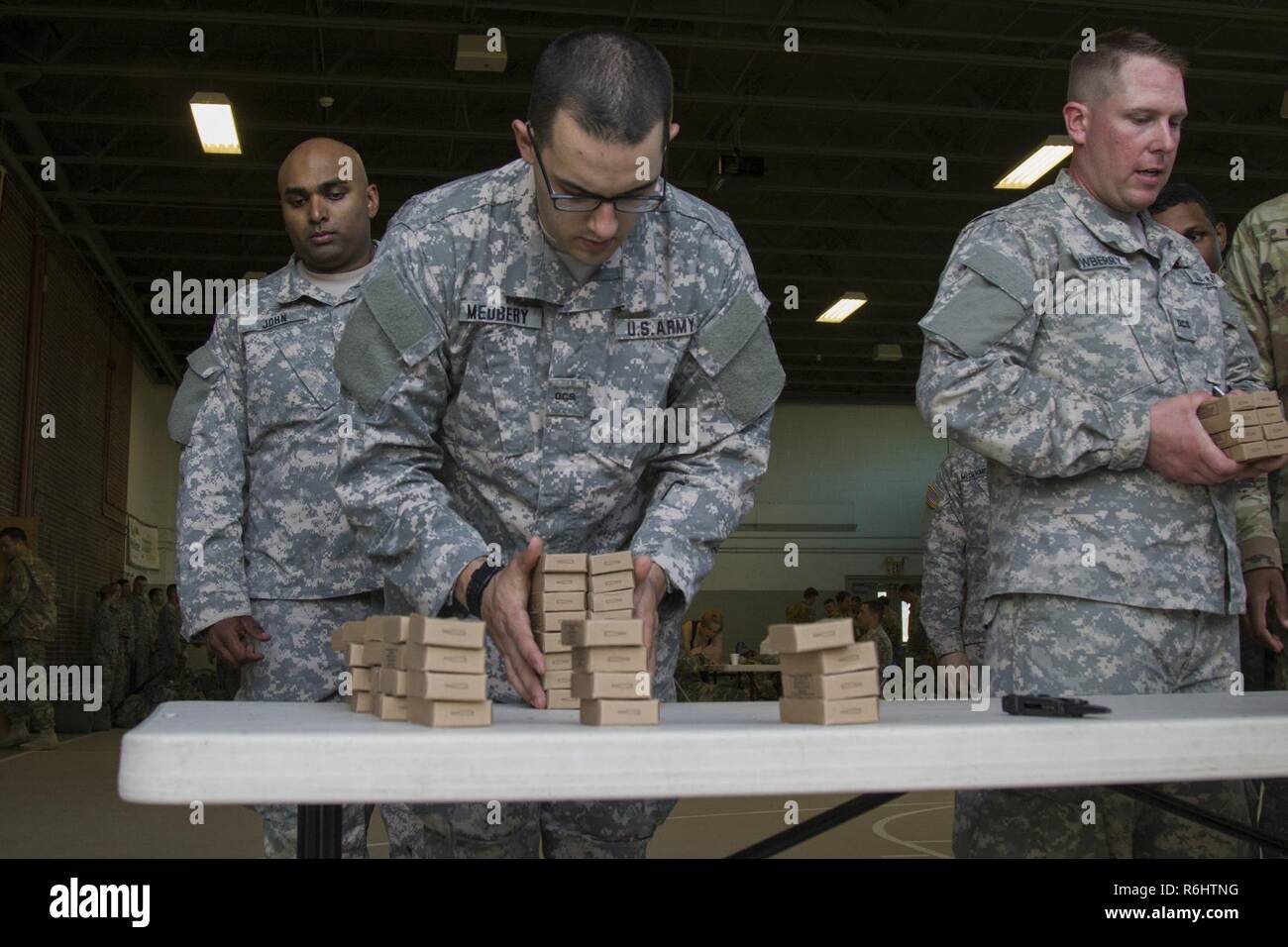 U.S. Army officer candidates acquire blank rounds for their field training exercise at New Hampshire National Guard Training Site in Center Strafford, Nh., May 18, 2017. Soldiers from Connecticut, Maine, Massachusetts, New Hampshire, New Jersey, New York, Rhode Island, and Vermont participated in the Officer Candidate School Field Leadership Exercise in preparation for graduation and commission. Stock Photo