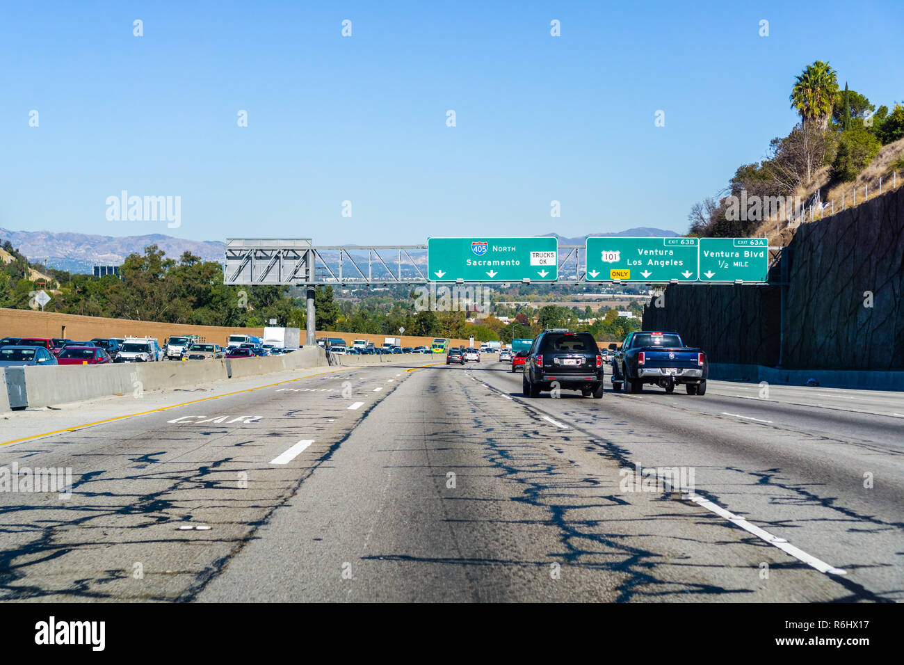 December 3, 2018 Los Angeles / CA / USA - Travelling on Highway 405 towards I5; heavy traffic on the other direction; damaged asphalt Stock Photo