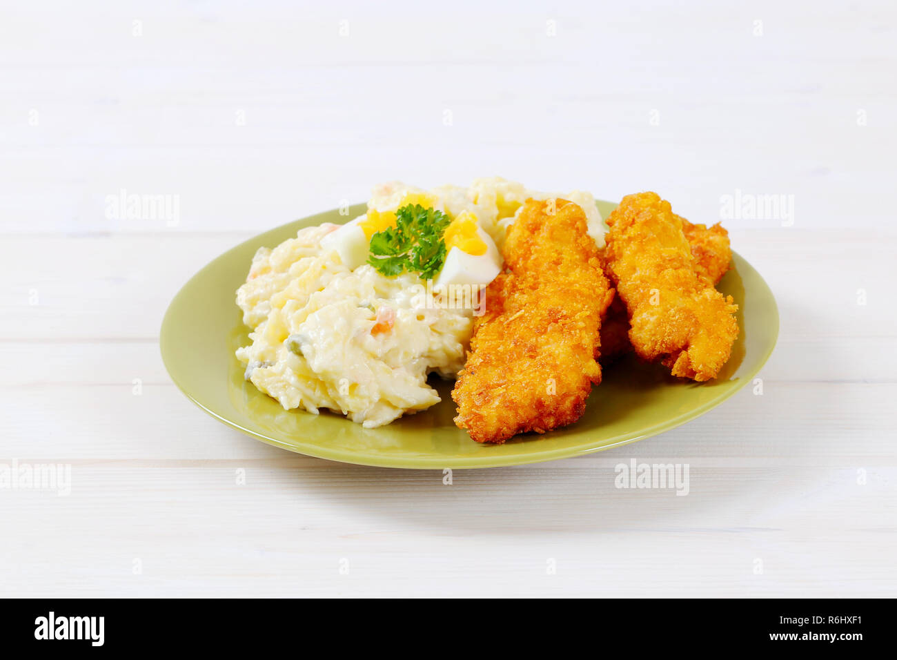 chicken strips with potato salad Stock Photo Alamy