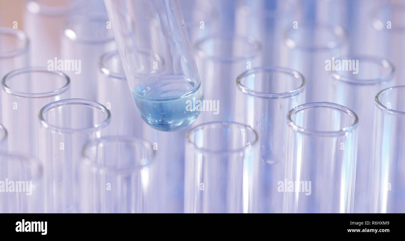 Using Dropper in Laboratory Stock Photo Alamy