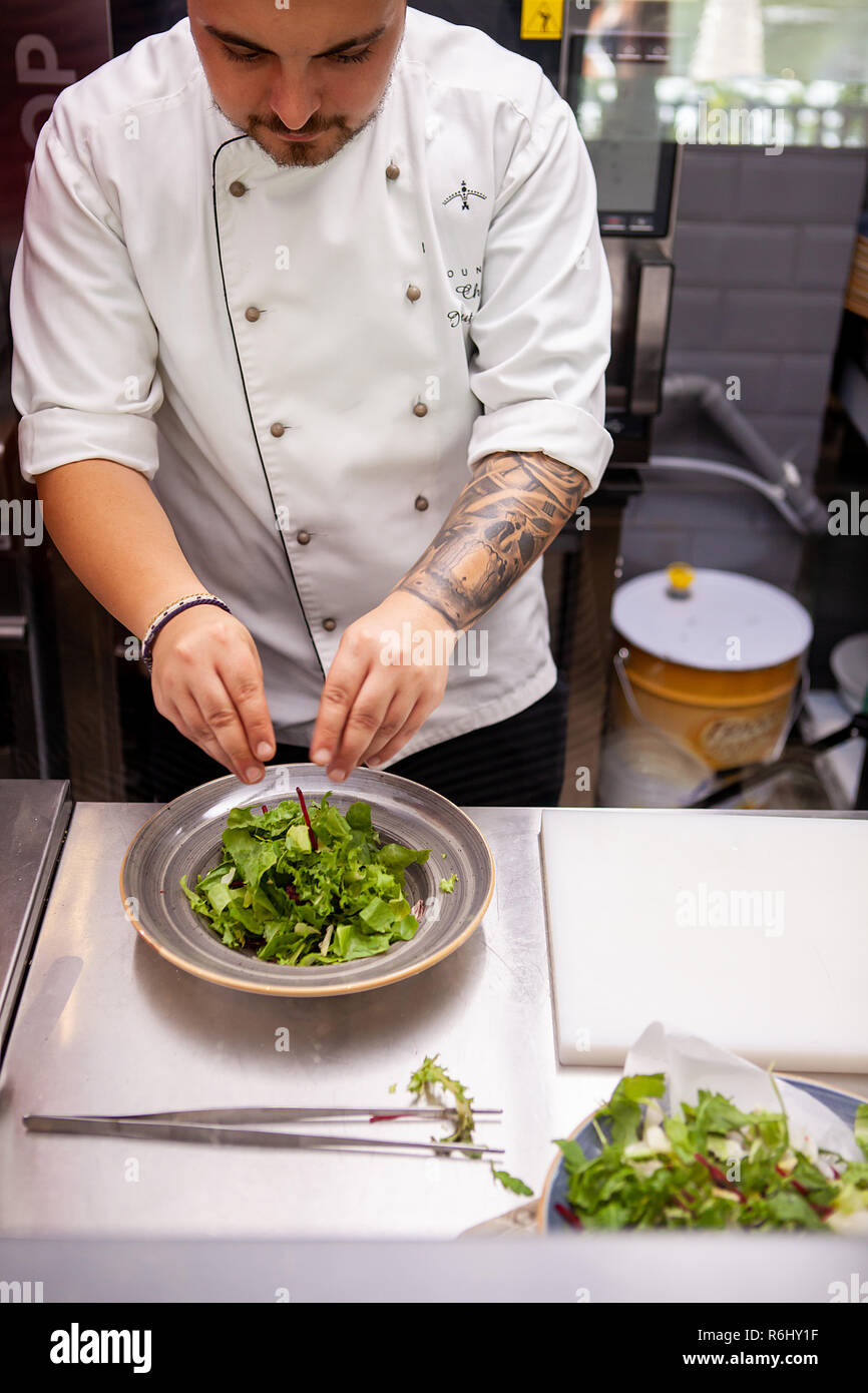 Chef Making delicious salade in restaurant kitchen Stock Photo