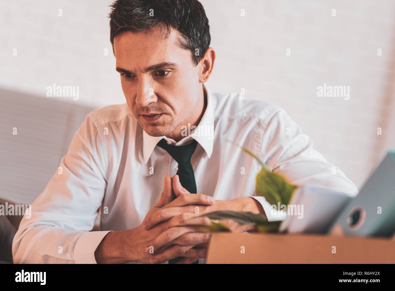Jobless man frowning and feeling desperate Stock Photo