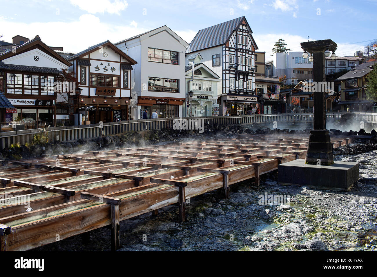 Hot steam rises from the Yubatake - Field of Hot Water, spring in the  centre of Kusatsu town, Japan Stock Photo - Alamy