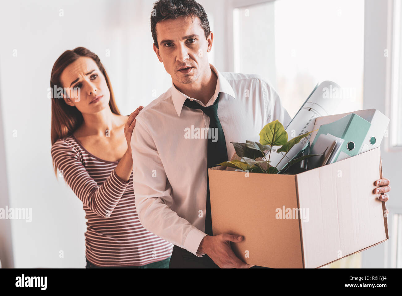 Middle aged man coming home after being dismissed Stock Photo
