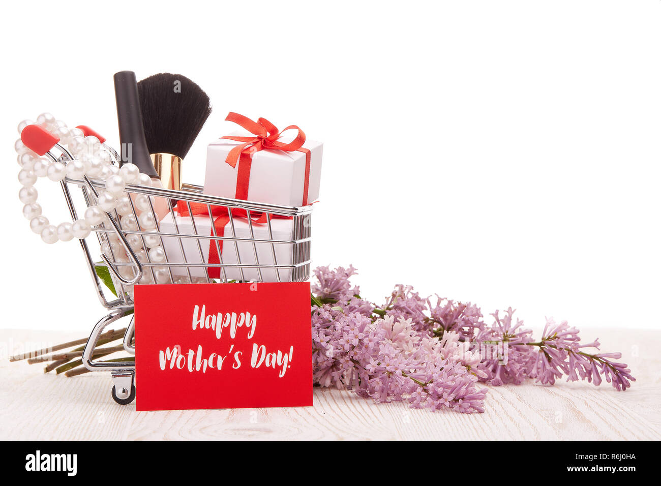 Lilac Flowers And Gifts On Shopping Trolley Stock Photo Alamy