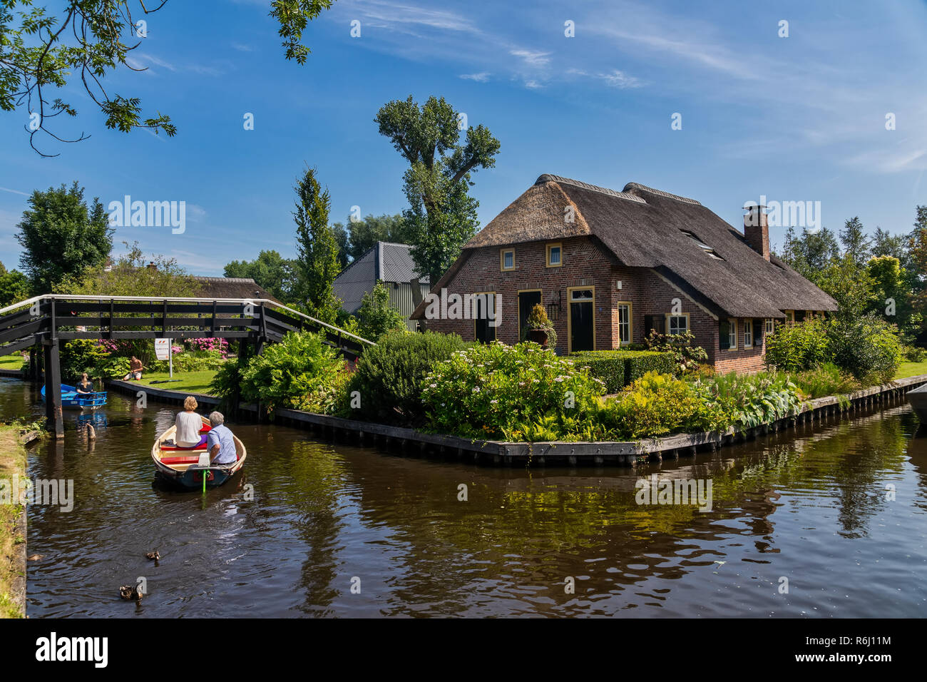 Giethoorn, Netherlands - July 4, 2018: view of famous village Giethoorn with canals in the Netherlands. Giethoorn is also called 'Venice of The Nether Stock Photo