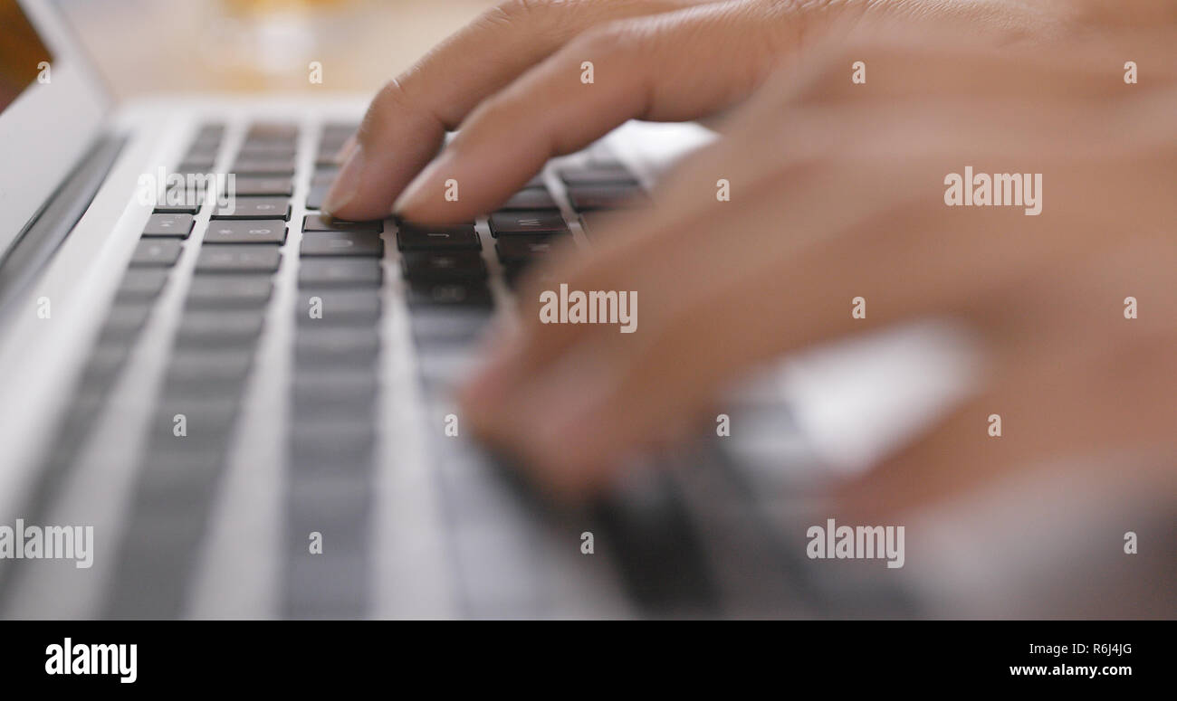 Typing on notebook computer Stock Photo Alamy