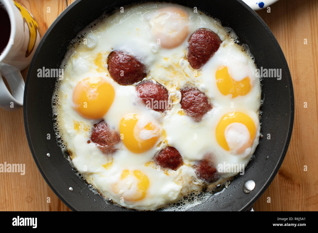 Traditional Turkish Breakfast, eggs with sucuk, bal kaymak, olives, ham