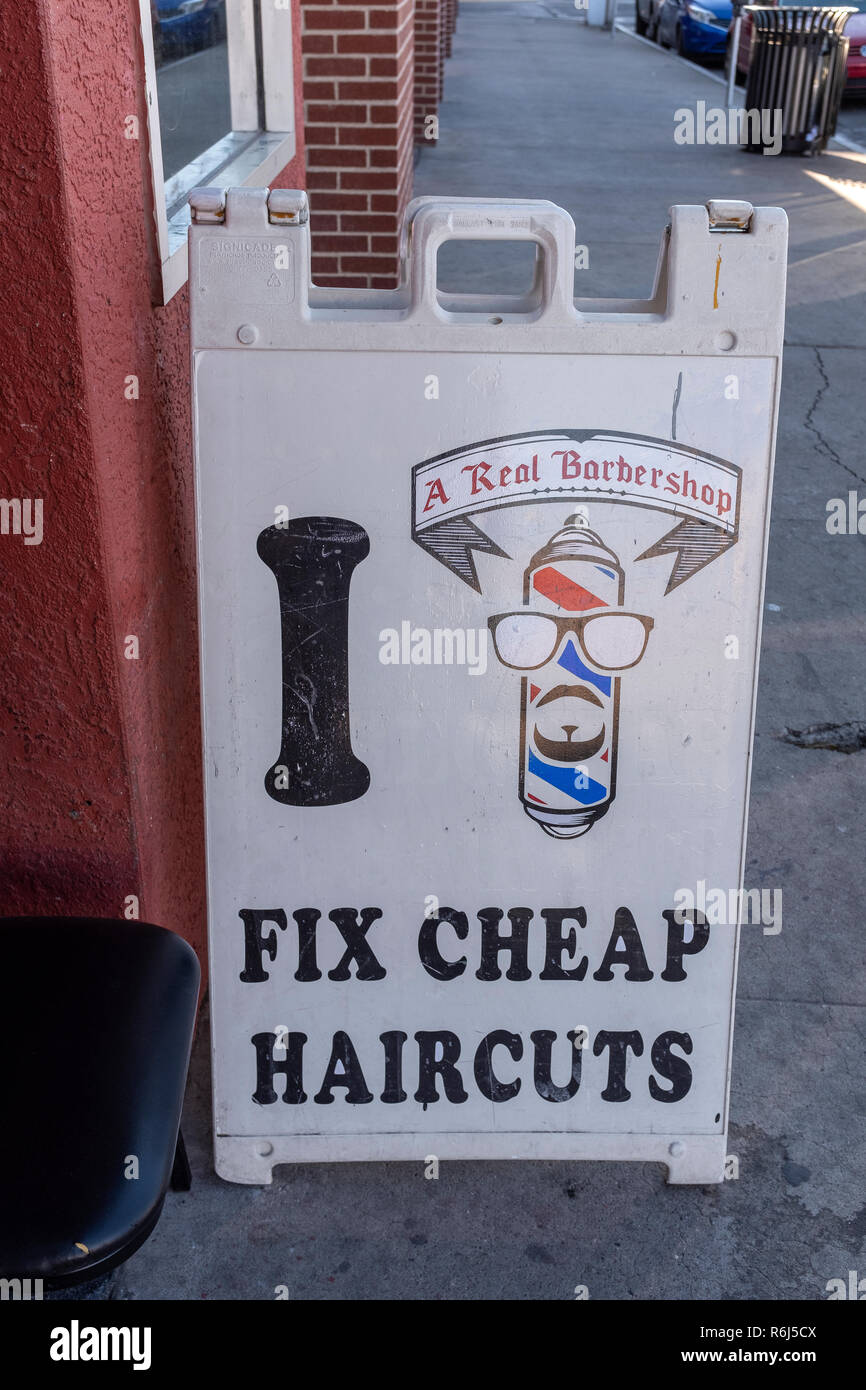 outdoor sign "I FIX CHEAP HAIRCUTS Stock Photo Alamy