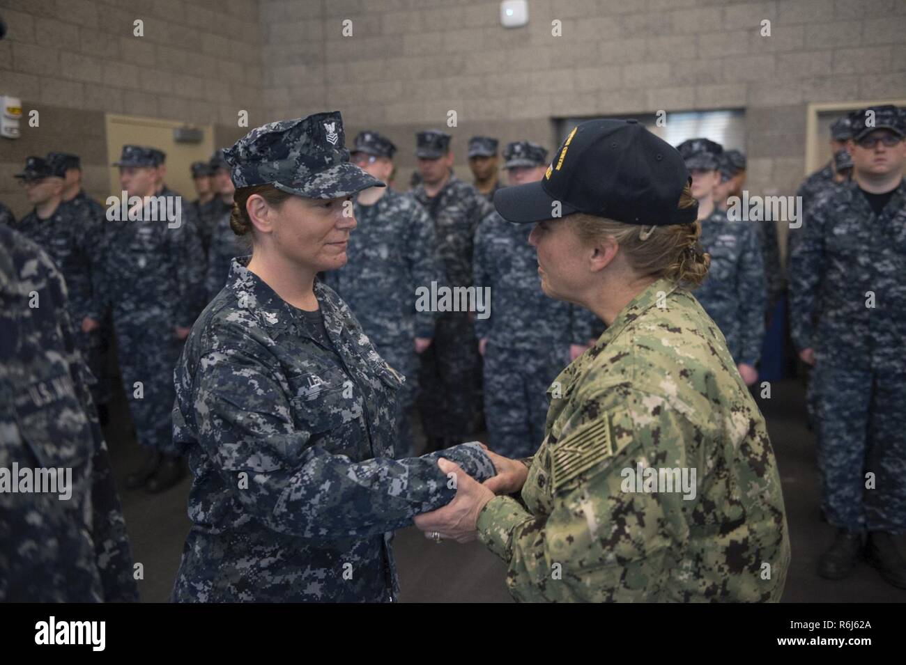 INDIANAPOLIS (May 20, 2017) Rear Admiral Linda Wackerman, Deputy Commander, U.S. Naval Forces Southern Command, 4th Fleet, visits with Sailors from Navy Operational Support Center Indianapolis during an Admirals Call. Wackerman who also serves as the flag mentor for NOSC Indianapolis, held an all-hands Q&A session for E-6 and below Sailors to address upcoming changes and get feedback regarding Navy-related issues they feel need to be improved. Stock Photo