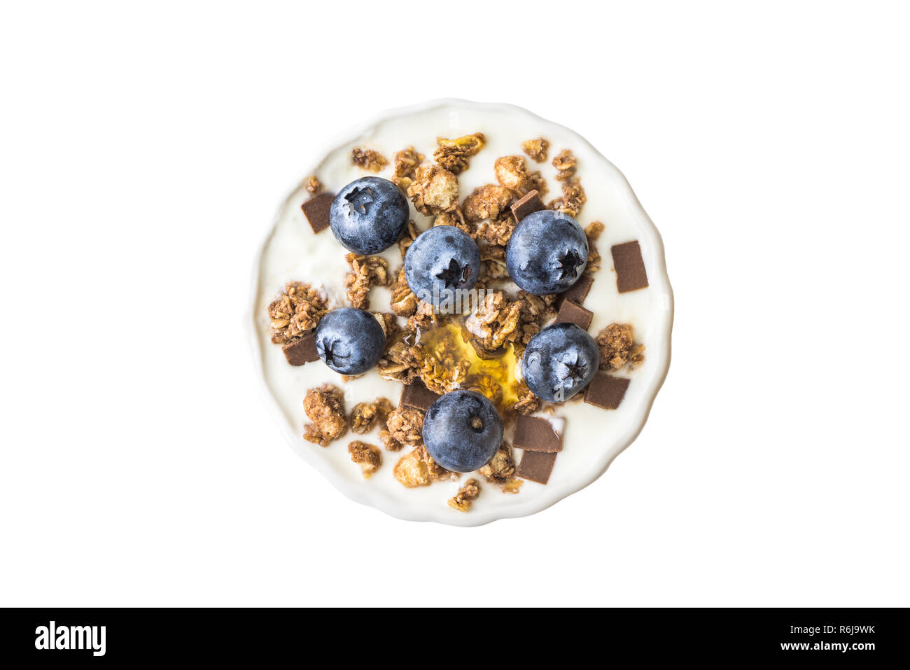 Bowl of Yogurt with Blueberries and Muesli Isolated on White Background, Top View Stock Photo