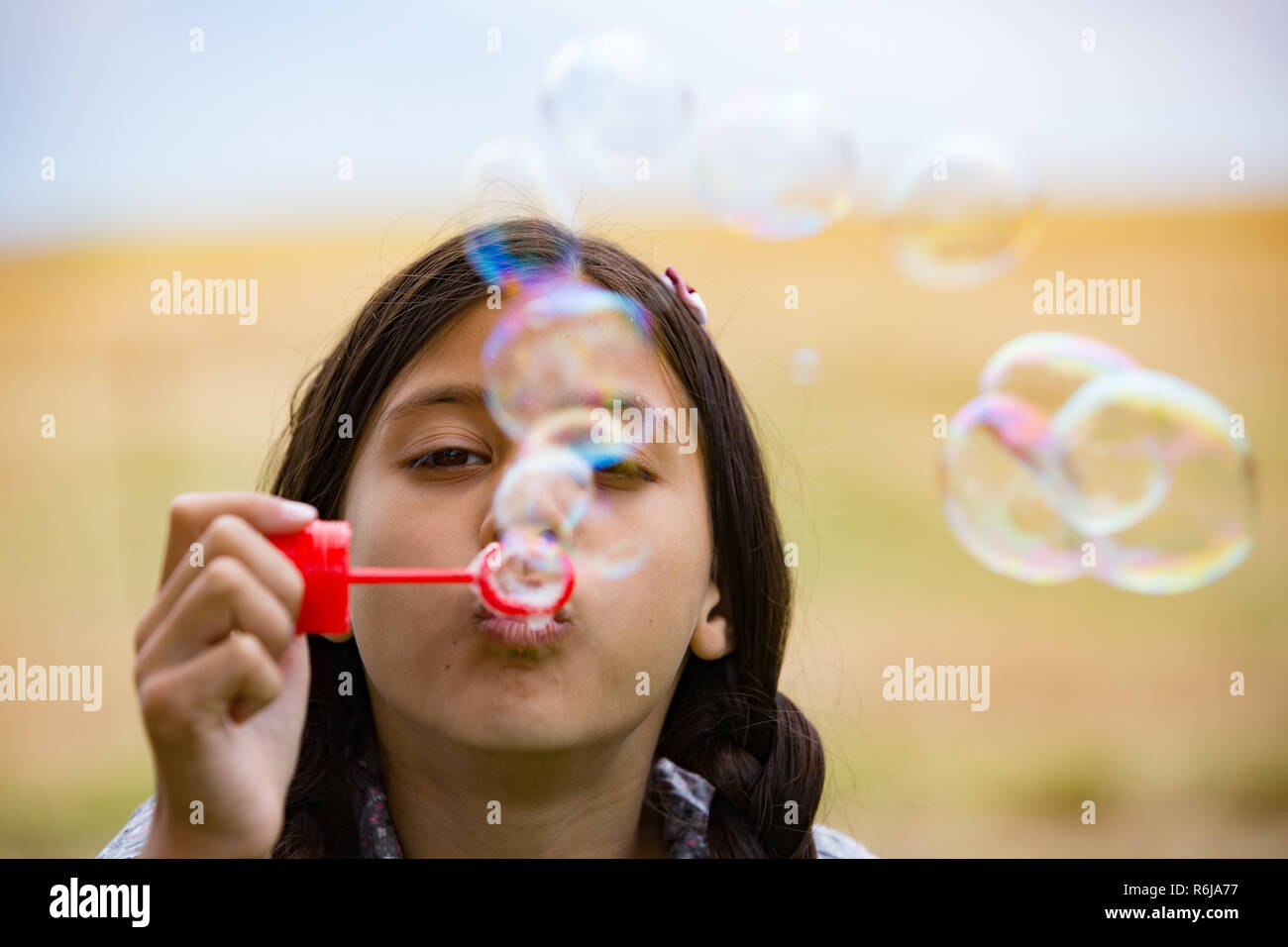 child makes soap bubbles Stock Photo Alamy