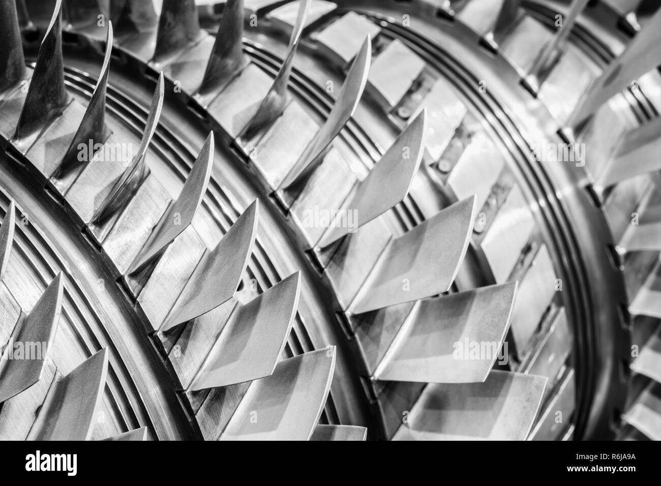Steel blades of turbine propeller. Close-up view. In B/W. Selected focus on foreground Stock Photo