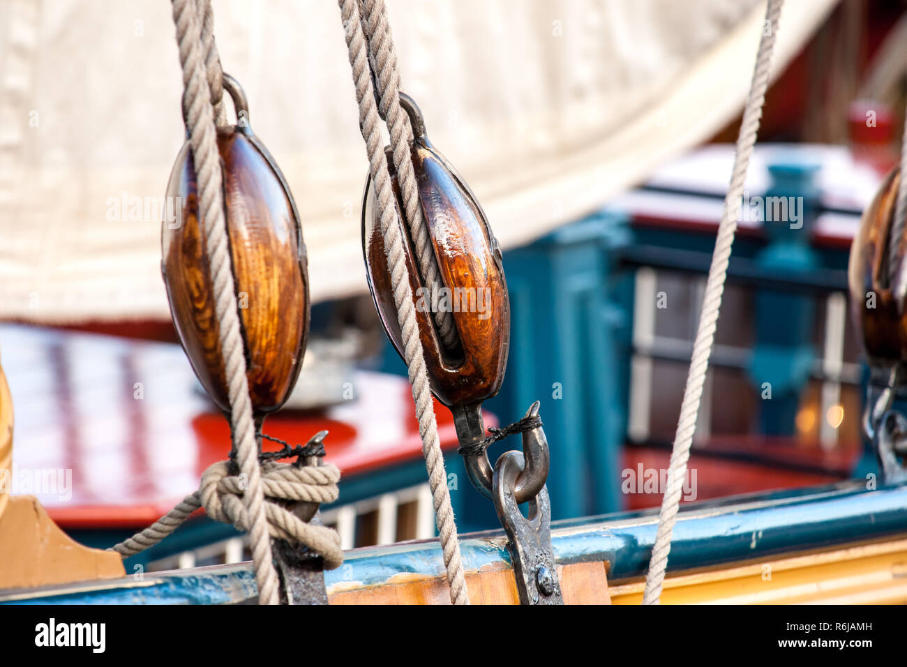 Detail of mast of ship. Detailed rigging with sails. Vintage sailing