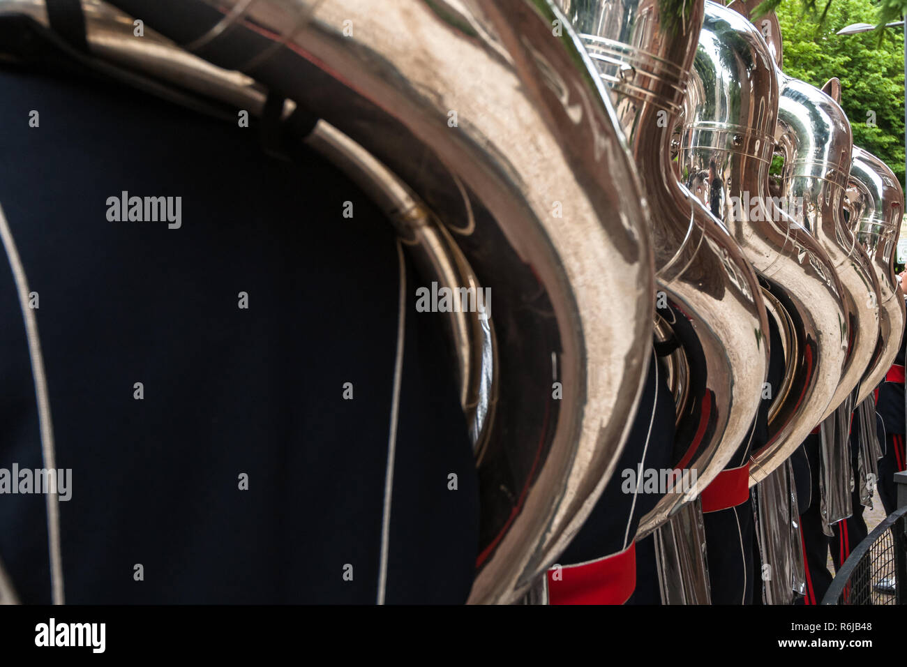 Details from a music, show and marching band. Playing musicians wind instruments in uniforms. Baritone, Mellofoon., trumpet, percussion. Concert band  Stock Photo