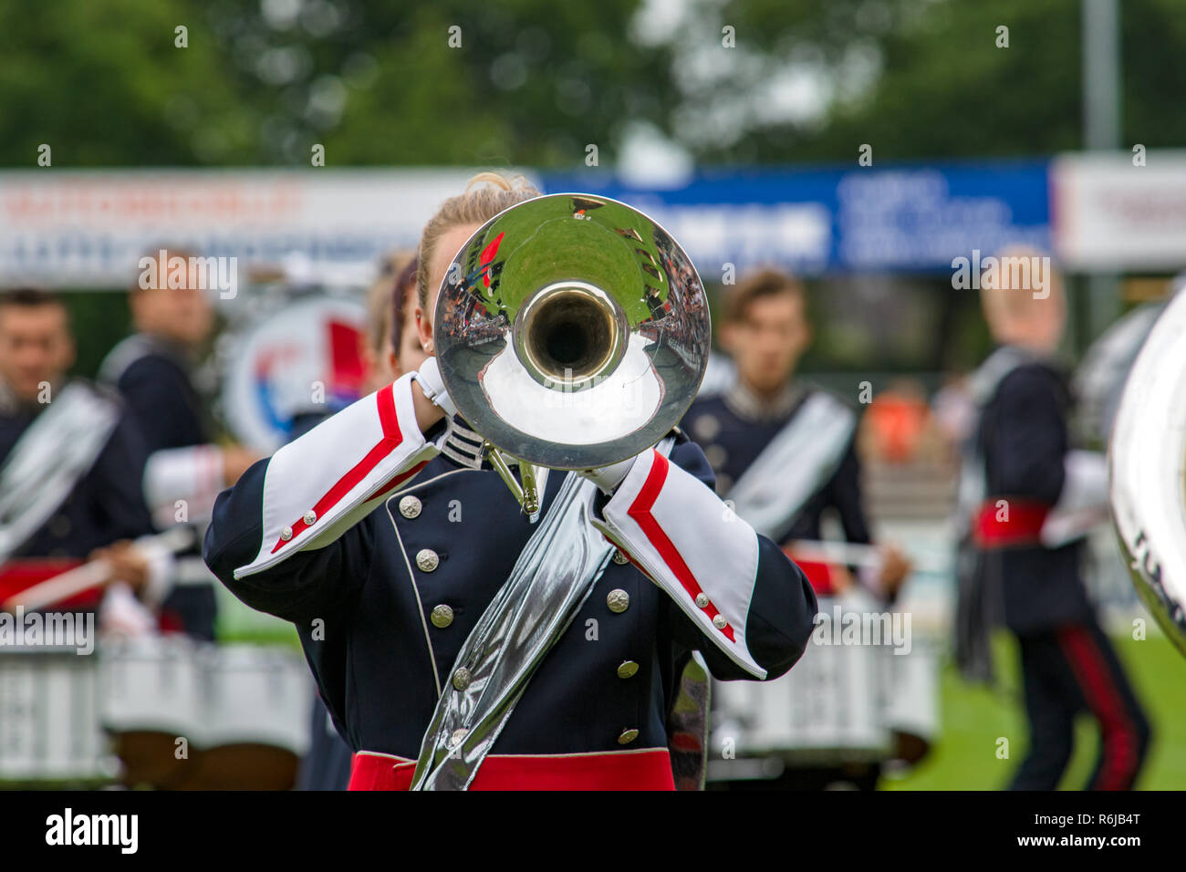 Details from a music, show and marching band. Playing musicians wind